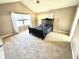 Serene bedroom with neutral carpeting, a ceiling fan, and a large window for natural light at 1470 Northern Valley Trl, Avon, IN 46123