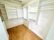 Walk-in closet features built-in shelving and a wood floor at 1470 Northern Valley Trl, Avon, IN 46123