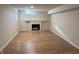 Spacious basement with a classic fireplace adding warmth and charm to the finished space at 1509 S Hawthorne Ln, Indianapolis, IN 46203
