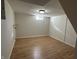 Clean basement area with vinyl flooring, ready for customization and finishing touches at 1509 S Hawthorne Ln, Indianapolis, IN 46203