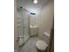 This bathroom features a walk-in shower, vanity, toilet and tiled floors at 1509 S Hawthorne Ln, Indianapolis, IN 46203