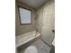This bathroom features a bathtub and shower combo and tiled floors at 1509 S Hawthorne Ln, Indianapolis, IN 46203
