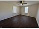 This bedroom features hardwood-style floors, a ceiling fan, and windows for natural light at 1509 S Hawthorne Ln, Indianapolis, IN 46203