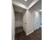 Bright hallway featuring clean, white walls and modern wood-look flooring at 1509 S Hawthorne Ln, Indianapolis, IN 46203