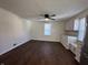 Bright kitchen with a ceiling fan, white cabinets, and stylish wood-look flooring at 1509 S Hawthorne Ln, Indianapolis, IN 46203