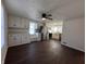 Spacious kitchen featuring white cabinets, stainless steel appliances, and stylish wood-look flooring at 1509 S Hawthorne Ln, Indianapolis, IN 46203
