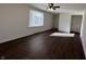Inviting living room with a ceiling fan, a bright window, and rich wood-look flooring at 1509 S Hawthorne Ln, Indianapolis, IN 46203