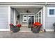Covered back patio with outdoor seating, fireplace, ceiling fan, and access to the backyard at 15297 Fairlands Dr, Westfield, IN 46074