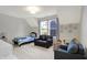 Cozy carpeted bedroom with sofa, -friendly decor, and large windows for natural light at 15297 Fairlands Dr, Westfield, IN 46074