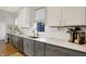 Stylish kitchen with modern stainless steel appliances, light gray countertops, sleek cabinetry, and ample counter space at 15297 Fairlands Dr, Westfield, IN 46074