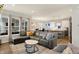 Spacious living room flowing into the kitchen and dining area, with modern furnishings at 15297 Fairlands Dr, Westfield, IN 46074
