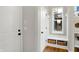 Functional mudroom with a built-in bench, storage baskets, and direct access to the outdoors at 15297 Fairlands Dr, Westfield, IN 46074