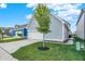 A lovely side view of a well-maintained house with a lush lawn and a spacious driveway leading to the garage at 15297 Fairlands Dr, Westfield, IN 46074