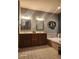 Elegant bathroom features double vanities, framed mirrors, and a jacuzzi bathtub at 16 Torrey Pine Dr, Brownsburg, IN 46112