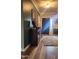 Inviting foyer features hardwood floors, a decorative console table, and a stylish front door with sidelights at 16 Torrey Pine Dr, Brownsburg, IN 46112