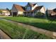 Attractive two-story home with blue and brick accents, an attached garage, and a perfectly manicured lawn at 16 Torrey Pine Dr, Brownsburg, IN 46112