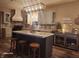 Charming kitchen features a large island, stylish backsplash, and modern lighting at 16 Torrey Pine Dr, Brownsburg, IN 46112