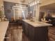 Open concept kitchen with large island, eat-in dining area, and updated appliances at 16 Torrey Pine Dr, Brownsburg, IN 46112