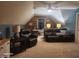 Spacious living area with plush seating, a ceiling fan, and an office space at 16 Torrey Pine Dr, Brownsburg, IN 46112