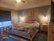 Cozy main bedroom features a ceiling fan, unique headboard, and neutral decor at 16 Torrey Pine Dr, Brownsburg, IN 46112