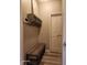 Mudroom featuring a wooden bench and shelf with hooks for organization near the front door at 16 Torrey Pine Dr, Brownsburg, IN 46112