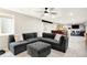 Cozy basement living area featuring a sectional couch, ceiling fan and transitions into dining and gym areas at 16808 Audley Ave, Westfield, IN 46074