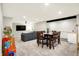 Finished basement featuring a large screen TV, living area, and dining table at 16808 Audley Ave, Westfield, IN 46074