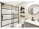 Modern bathroom showcasing a glass-enclosed shower, floating shelves, and sleek fixtures at 16808 Audley Ave, Westfield, IN 46074
