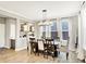 Elegant dining room featuring a modern chandelier, natural light, and stylish decor that creates an inviting atmosphere at 16808 Audley Ave, Westfield, IN 46074