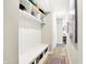 Functional hallway with built-in storage, a bench, and hooks, providing an organized and welcoming entry space at 16808 Audley Ave, Westfield, IN 46074