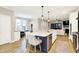 Open-concept kitchen with a large island, modern appliances, and seamless flow into the living area at 16808 Audley Ave, Westfield, IN 46074