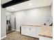 Bright kitchenette features stainless steel refrigerator, white cabinets, butcher block countertops and laminate floors at 16808 Audley Ave, Westfield, IN 46074