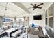 Covered patio boasting a sectional sofa, dining table, ceiling fan, and string lights for an inviting outdoor space at 16808 Audley Ave, Westfield, IN 46074