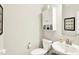 Neutral powder room featuring a vanity, toilet, and decor that creates a fresh and clean space at 16808 Audley Ave, Westfield, IN 46074