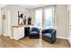 Cozy sitting room featuring comfortable armchairs, a wine cooler, and natural light from large windows at 16808 Audley Ave, Westfield, IN 46074