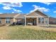 Brick home with a covered patio and spacious lawn, perfect for outdoor entertaining at 1684 Hedley W Way, Avon, IN 46123