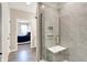 Modern bathroom with a glass-enclosed shower and a view into an adjacent bedroom at 1684 Hedley W Way, Avon, IN 46123