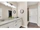 Bathroom featuring a double sink vanity with quartz countertop, and a walk-in shower at 1684 Hedley W Way, Avon, IN 46123