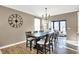 Inviting dining area with hardwood floors, chandelier, and a large table perfect for Gathering gatherings at 1684 Hedley W Way, Avon, IN 46123