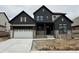 New two-story home showcasing a modern farmhouse exterior and a two-car garage at 19854 Chatham Shore Ln, Westfield, IN 46074