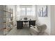 Bright home office with stylish desk, shelving, and comfortable seating area at 19854 Chatham Shore Ln, Westfield, IN 46074