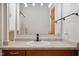 Bathroom featuring a modern vanity, faucet, and fixtures, plus a decorative mirror at 2022 Newton St, Columbus, IN 47201