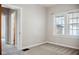 Neutral bedroom featuring carpet flooring, natural light, and traditional trim at 2022 Newton St, Columbus, IN 47201