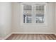 Bedroom featuring carpet flooring, neutral paint, and a pair of windows at 2022 Newton St, Columbus, IN 47201