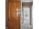 Hallway featuring hardwood door and trim, and views into the bedroom at 2022 Newton St, Columbus, IN 47201