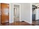 Hallway leading to the kitchen with dark blue cabinets and a carpeted hallway creating a comfortable and functional living space at 2022 Newton St, Columbus, IN 47201