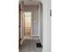 Hallway featuring neutral walls, plush carpeting, and access to a bathroom, creating a seamless transition between spaces at 2022 Newton St, Columbus, IN 47201