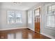 Bright living room with hardwood floors, fresh paint, and plenty of natural light at 2022 Newton St, Columbus, IN 47201