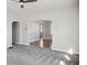 Open living area with new gray carpet, neutral paint, and archway to adjacent room at 2022 Newton St, Columbus, IN 47201