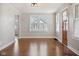 Inviting living room with hardwood floors, neutral paint, and an open doorway at 2022 Newton St, Columbus, IN 47201